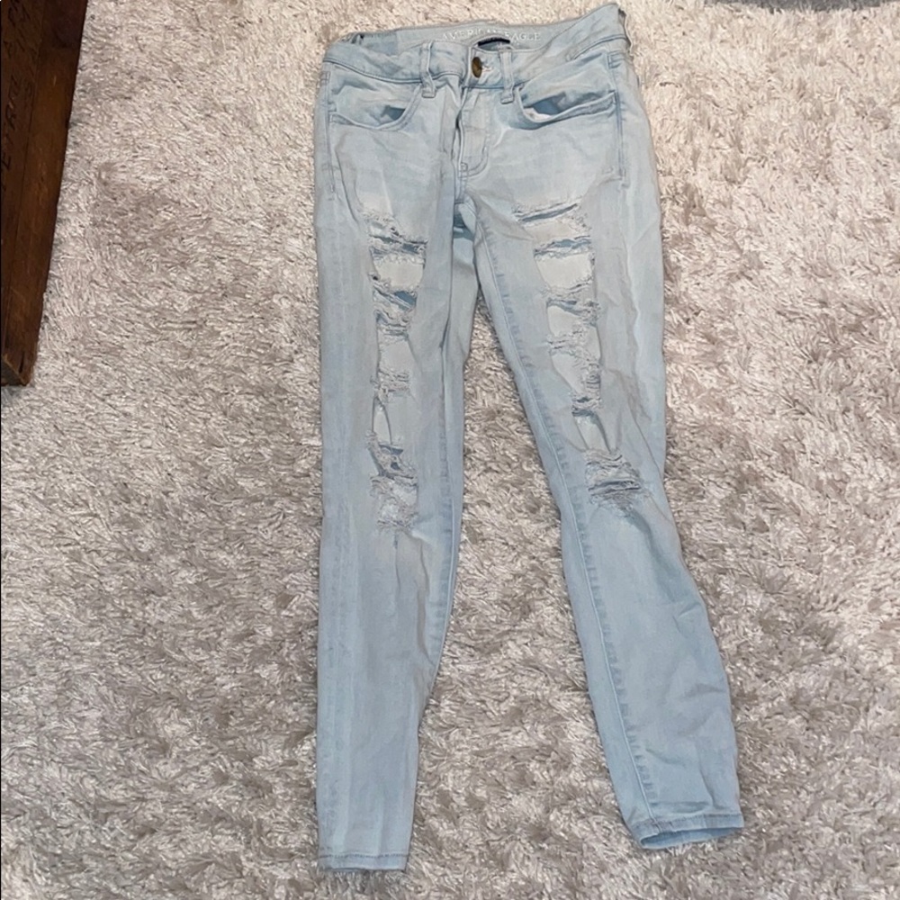Distressed light wash jeans